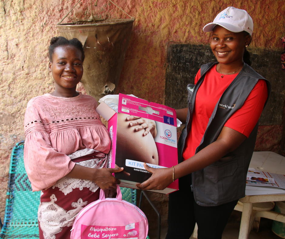 Pregnant woman receiving her maternity kit